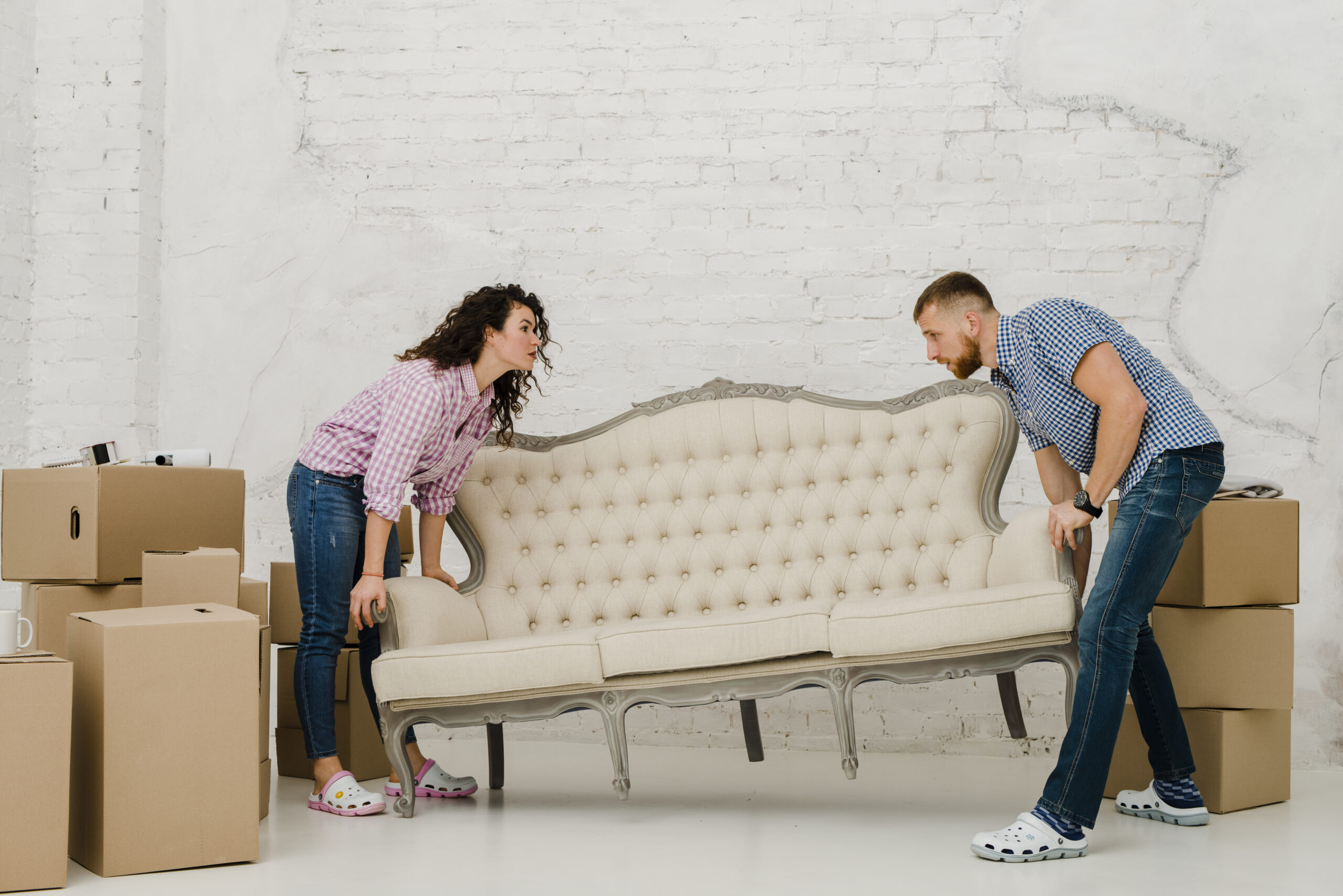 couple-moving-sofa-scaled-1
